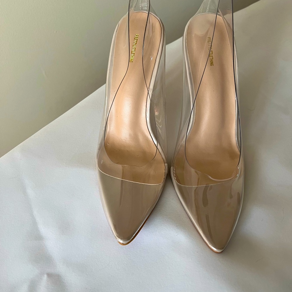 Women dress shoes. New never worn. Clear color.
